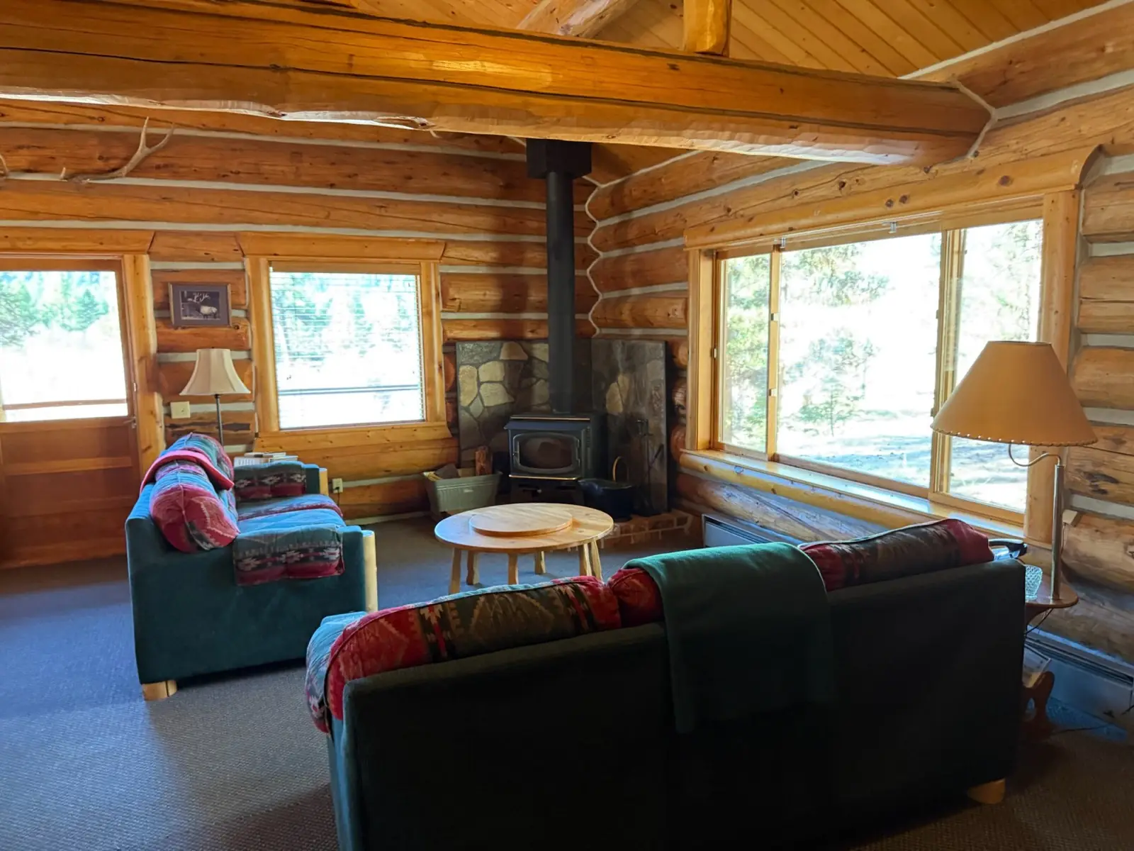 The Ponderosa cabin kitchen with a long log dining table