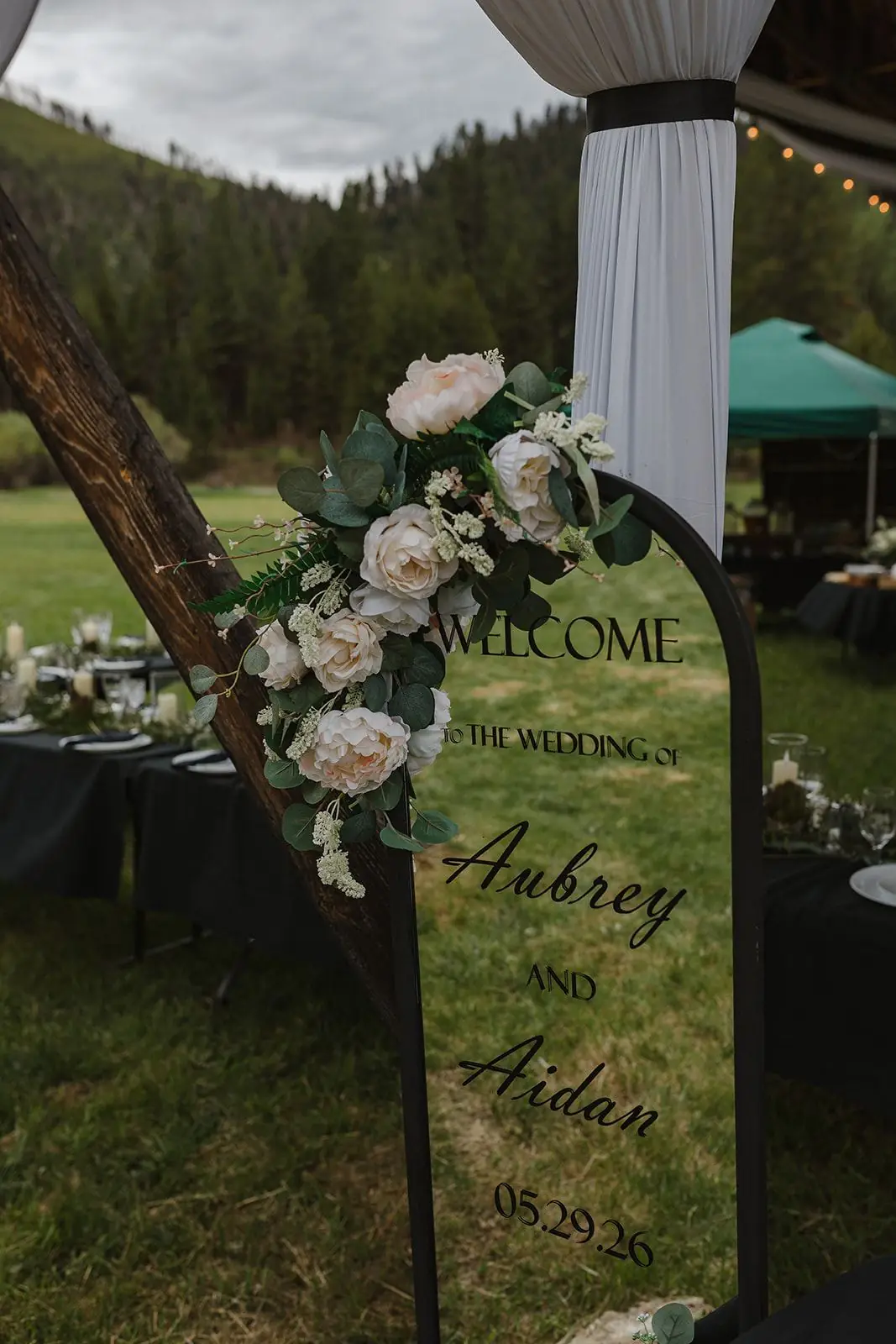 A floral welcome sign for a ranch wedding